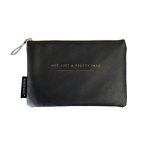 Alice Scott Black Makeup Bag featuring gold lettering detail with the quote 'Not Just a Pretty Face.' It has a stylish humbug stripe lining, is made from PU and has a zip fastening.